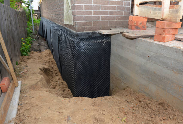 Happy homeowners after waterproofing job in Higginsport
